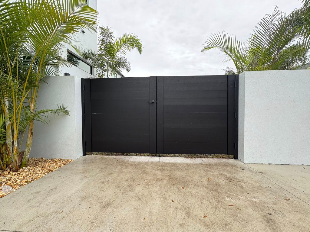 Custom modern black metal driveway gate